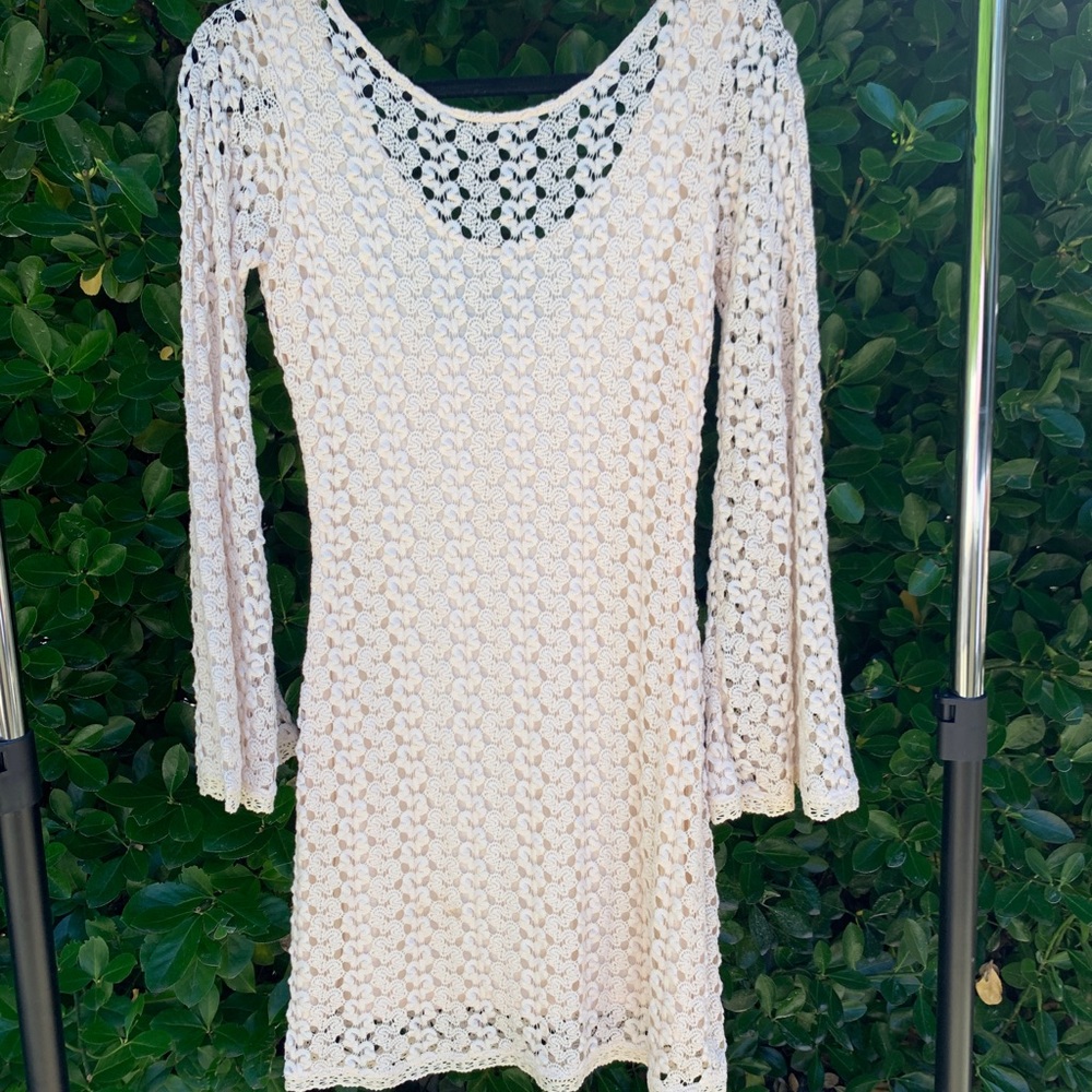 Intricate crochet dress with wide sleeves